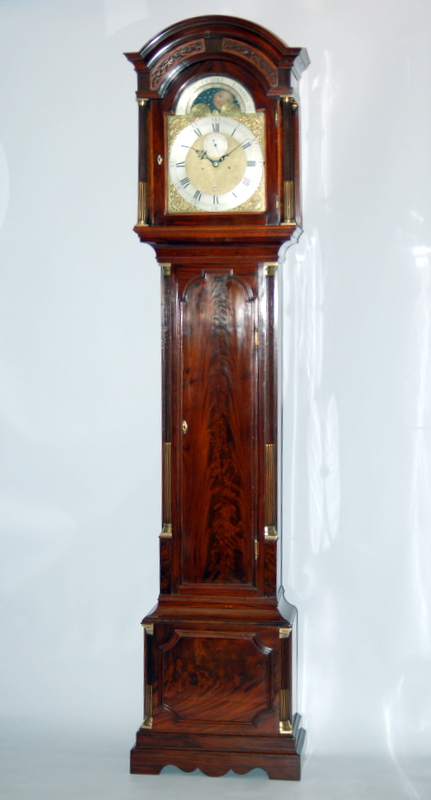 Lovely mahogany veneers and case features of this top quality London clock by James Clarke