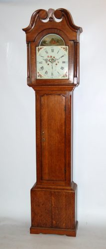 Rare oak clock by Barber Winster